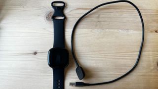 Fitbit Versa 3 with charging cable