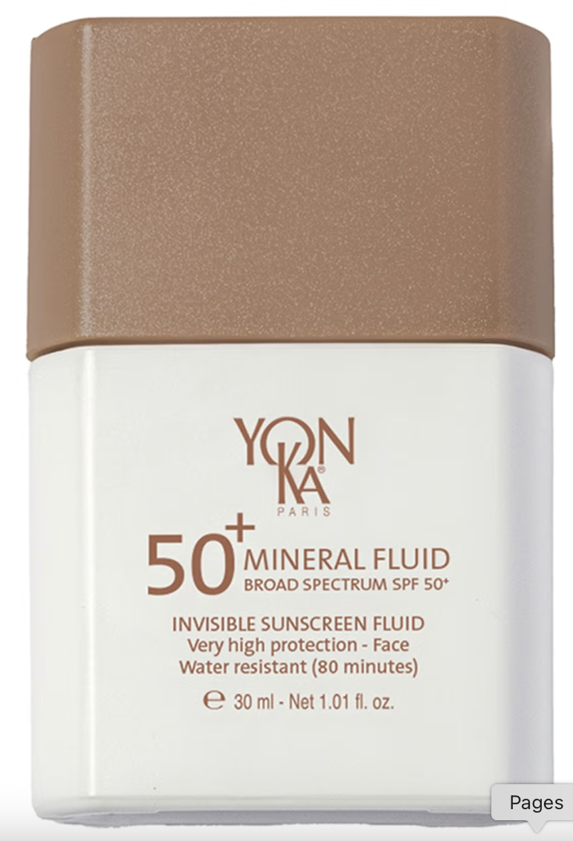 a white bottle of sunscreen with a tan top and tan writing