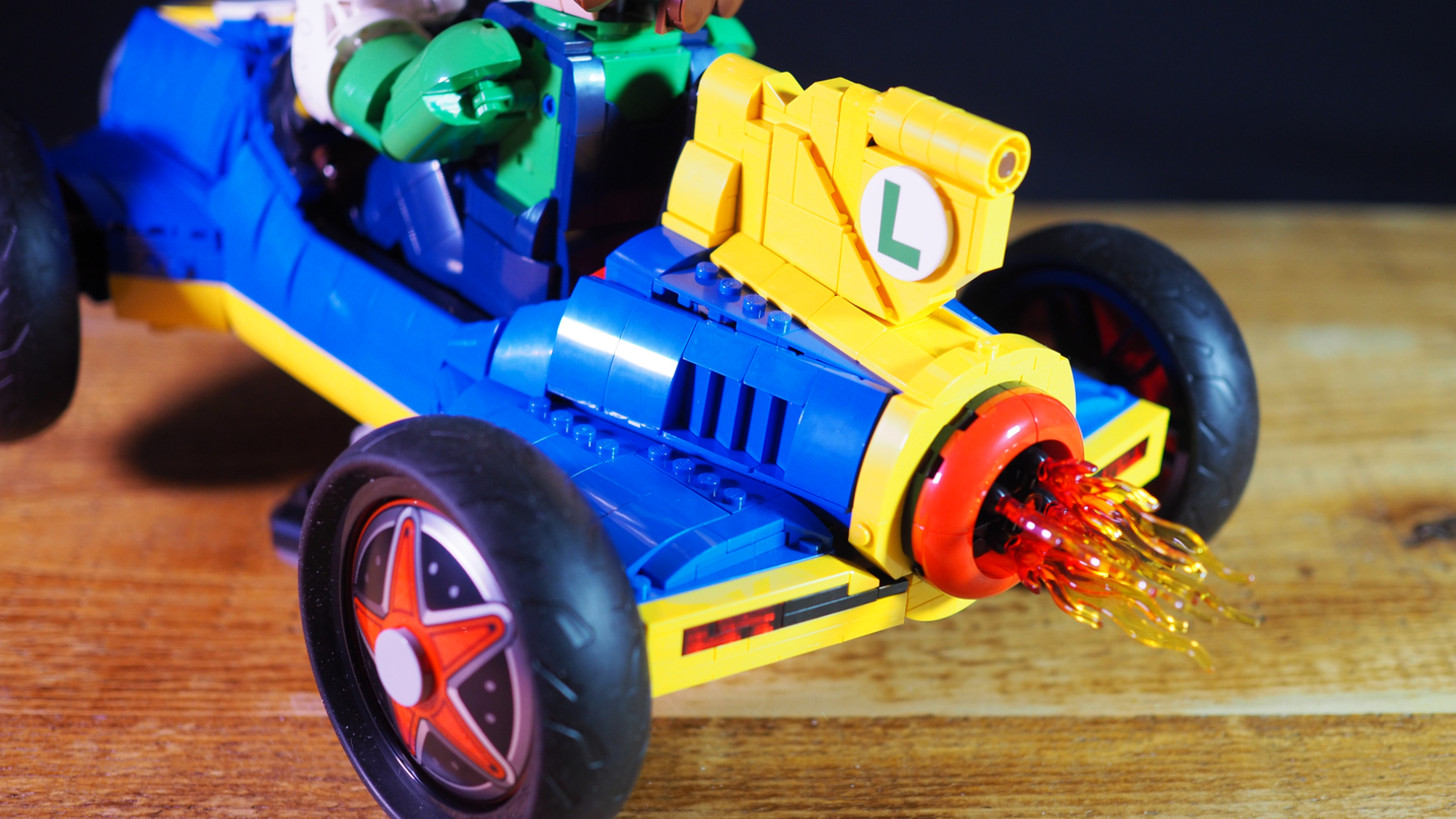Lego Mach 8 Kart seen from behind, with flames coming out of the exhaust
