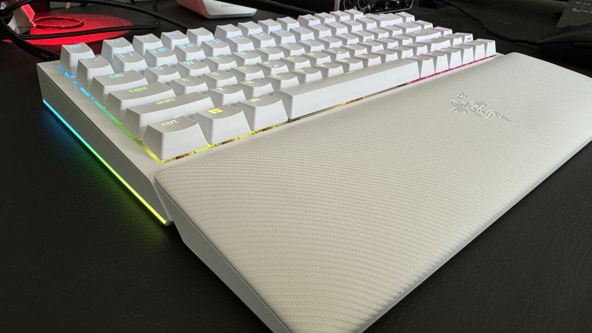 Razer BlackWidow V4 75% gaming keyboard set-up on a desk with RGB enabled.