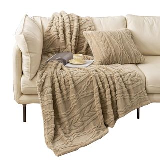 A YUSOKI Sherpa Throw Blanket on a couch