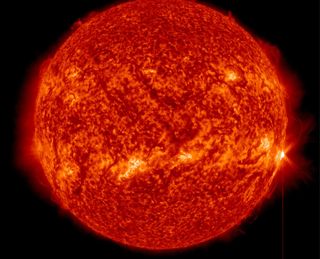 A full-disk view of the sun as an X1.3-class solar flare (far right) erupts on April 24, 2014 EDT (April 25 GMT).
