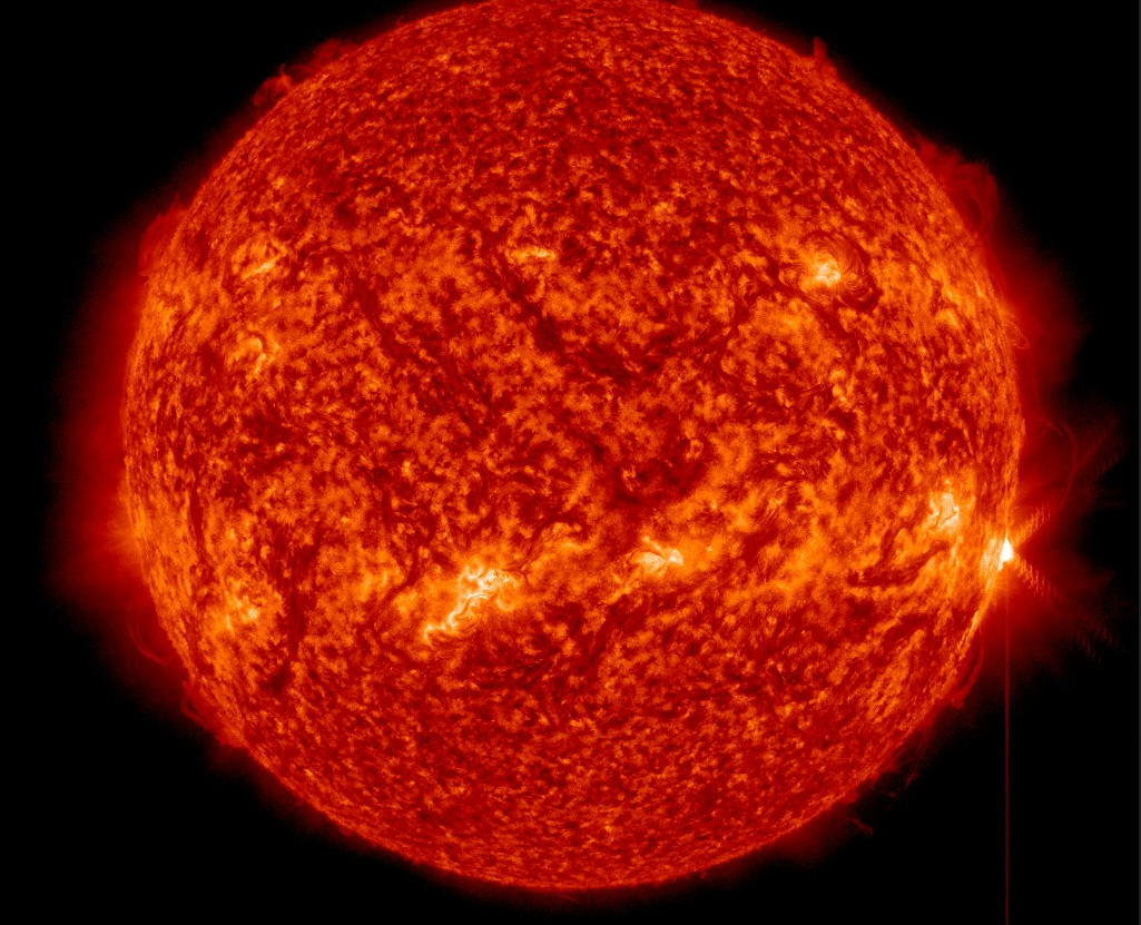 A full-disk view of the sun as an X1.3-class solar flare (far right) erupts on April 24, 2014 EDT (April 25 GMT).