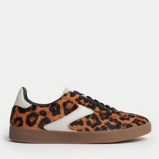 Flat lay image of leopard print trainers