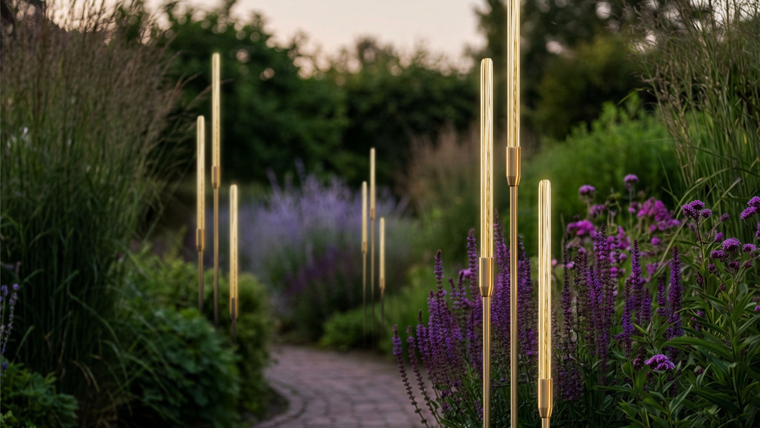 bullrush outdoor lighting in a pretty garden with a path and purple flowers