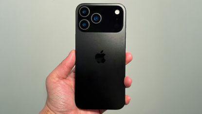 iPhone 17 Pro leak &ndash; dummy handset held against green background
