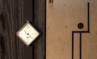 Siza Lebond square watch on wooden surface