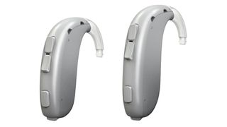 An image showing two Silver Grey color Oticon Xceed SP hearing aids