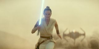 Rey running from a TIE fighter
