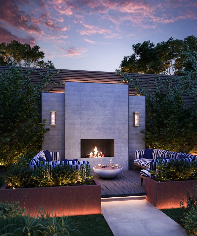 An example of patio lighting ideas showing a patio with sofas, an outdoor fireplace and large wall lights
