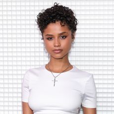 Tyla with a pixie haircut and wearing a white t-shirt