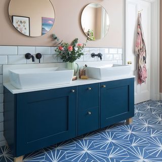 peach and blue bathroom with vanity unit