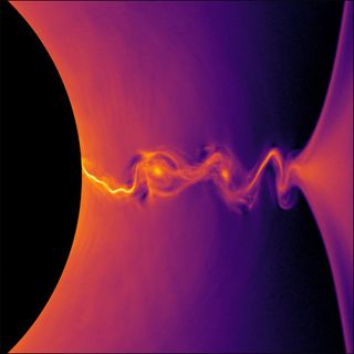 A visualization from a supercomputer simulation shows how positrons behave near the event horizon of a rotating black hole.