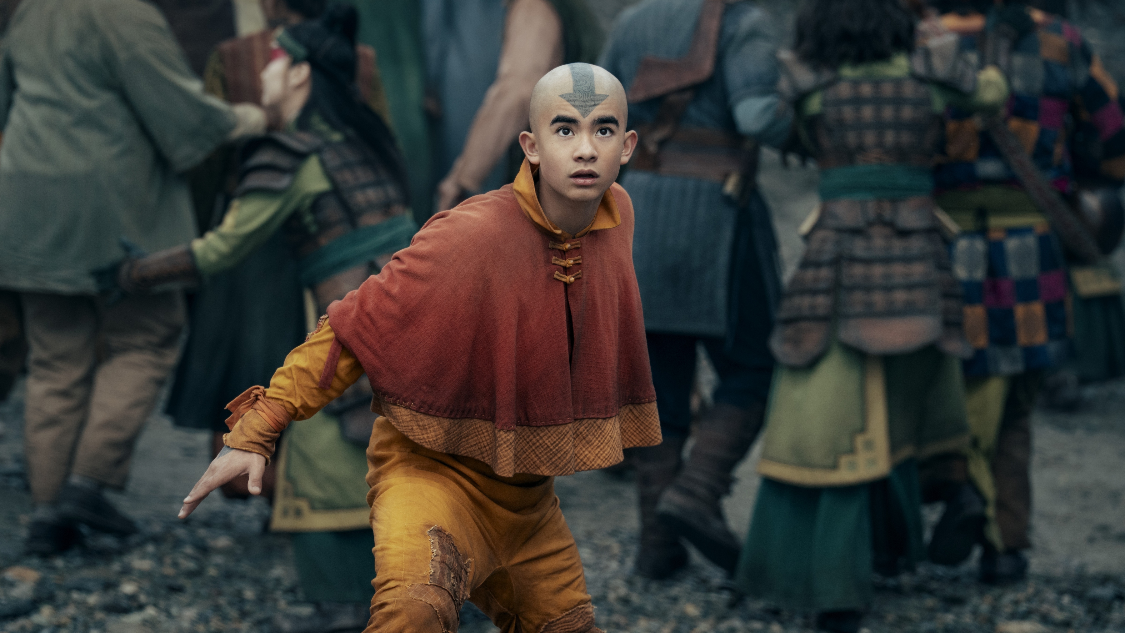 Gordan Cormier as Aang in season 2 of Avatar: The Last Airbender looking up at something off camera.