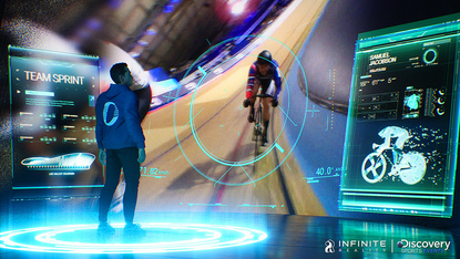A person watches an immersive image of track cycling in the metaverse