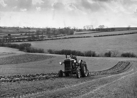 A farmer ploughs his field with a tractor in the only place where the medieval open field strip system was still in use. Each farmers land is divided into six or more patches, making husbandry difficult, however it does ensure that each has an equal share of good land. The fields can not be fencedand the sanctity of the boundaries is watched over by the Court Leet, composed of householders. (Photo by © Hulton-Deutsch Collection/CORBIS/Corbis via Getty Images)