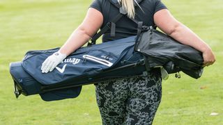 woman using Callaway Hyperlite Zero Double Strap Stand Bag on her back