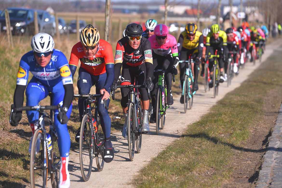 The riders avoid the cobbles in the cobbled sector