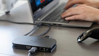 USB hub connected to laptop on desk