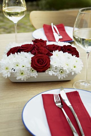 red white flowers on a table