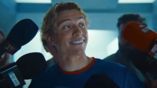 Tom Holland smiling with blonde hair in his Lego ad.