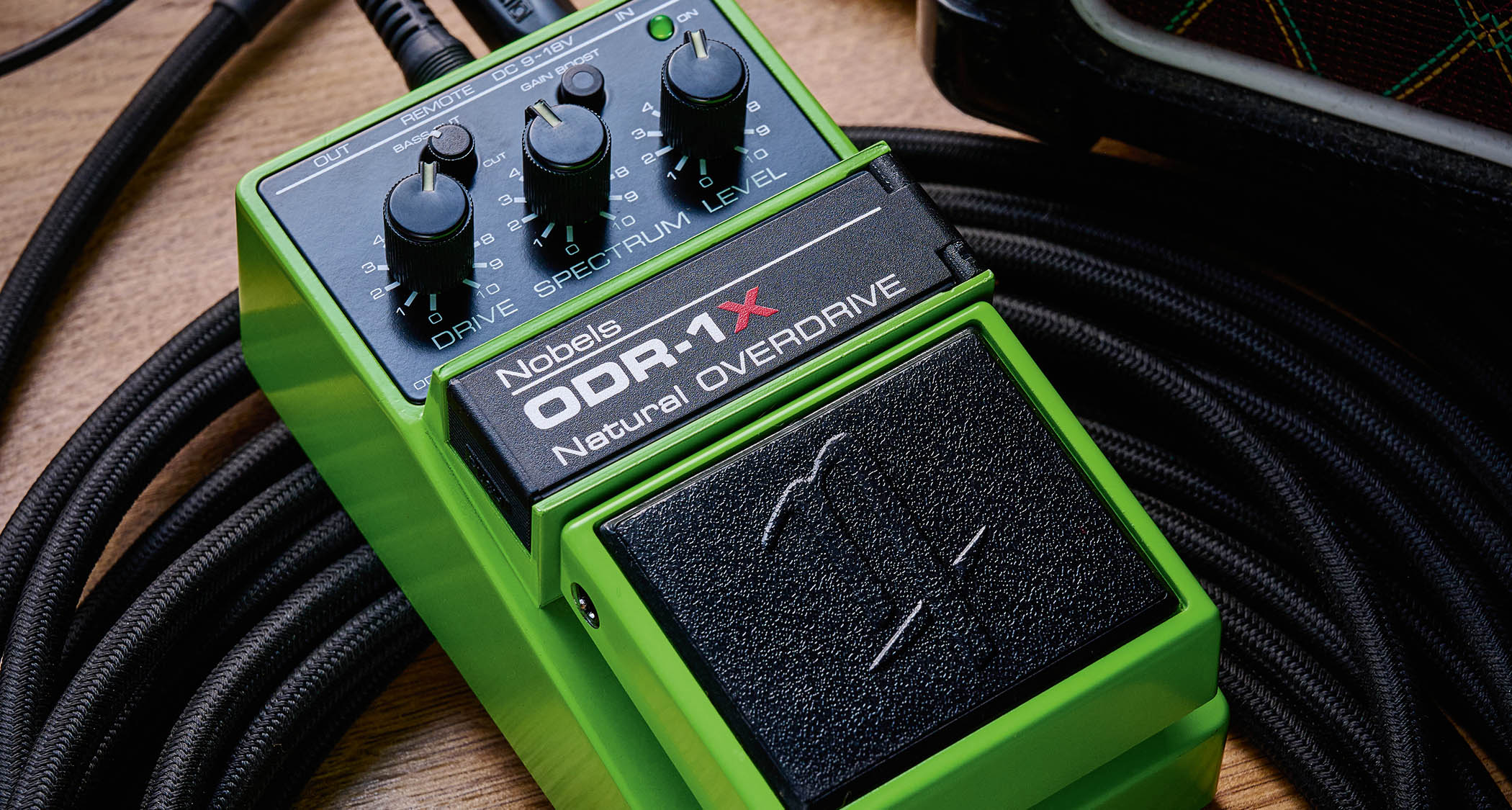 Nobels ODR-1X: the latest iteration of the &quot;other&quot; classic green drive pedal is pictured ontop of a coiled guitar cable.