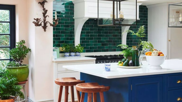 A colorful kitchen with green tile and kitchen island