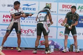 The podium spray was on for all in Chengmai with (l-r): Saleh, Manan and Rogers out to get each other with the champagne..