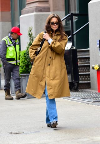 Katie Holmes walks in New York City wearing a pair of loafers also worn by Taylor Swift