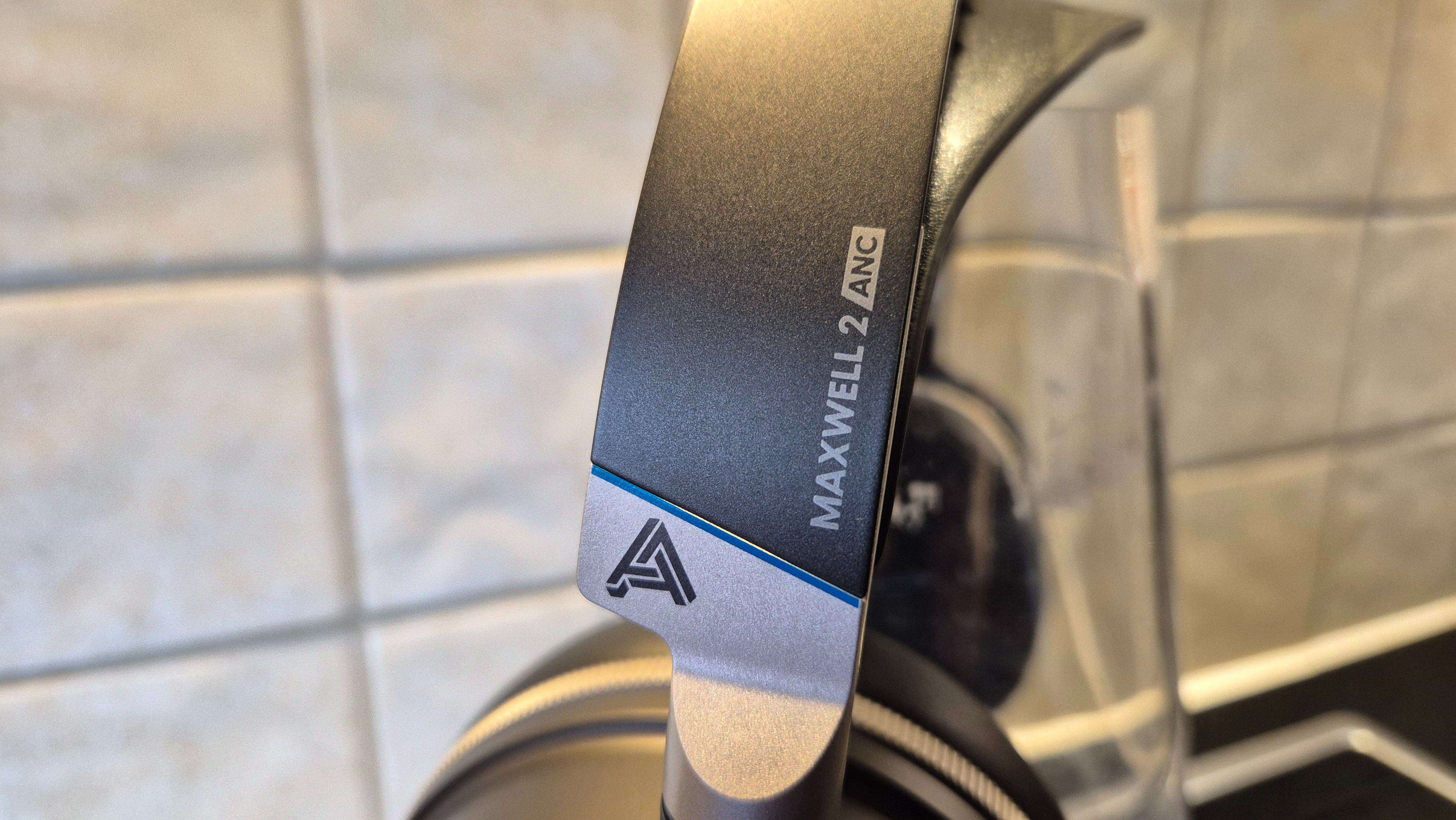 A close up picture of the Audeze Maxwell 2 ANC gaming headset showing off its branding and logo