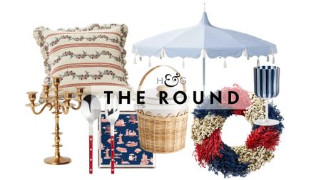 Chic Fourth of July decor, including a gold candelabra, antique-style cushion cover, set of three patriotic geese, woven ice bucket, tassel outdoor umbrella, and red-white-and-blue festive wreath