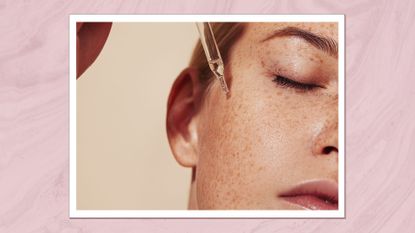 Woman applying epidermal growth factors (EGF) to her skin in a serum