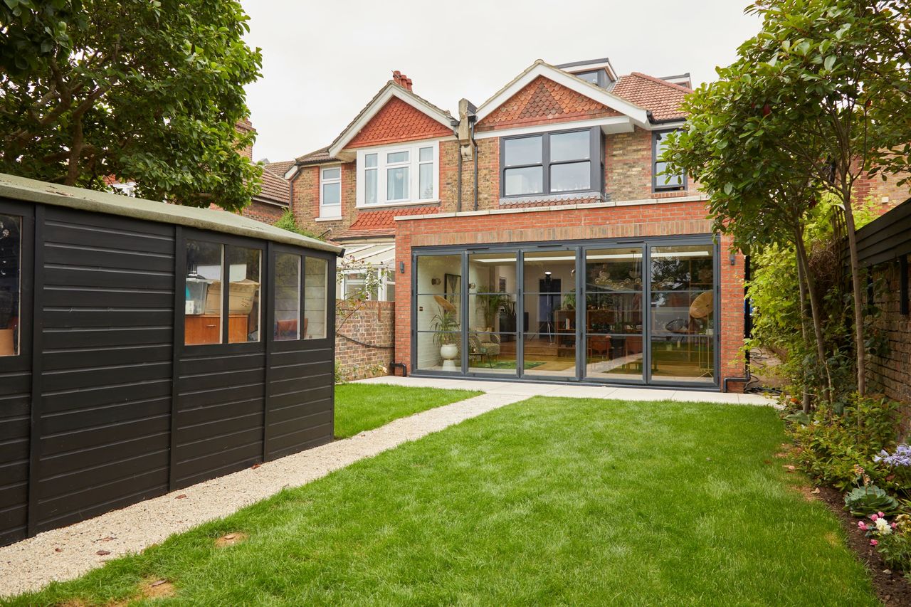 The garden has a black shed and a newly renovated conservatory which extends from the kitchen