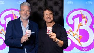 Christopher McQuarrie and Tom Cruise buying tickets for Barbie