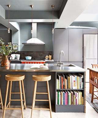kitchen island with steel countertop and bookshelves