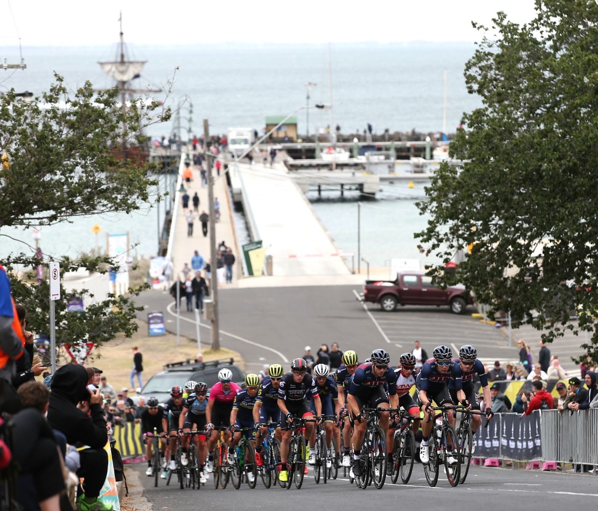 The peloton is led by JLT Condor up the steep hill
