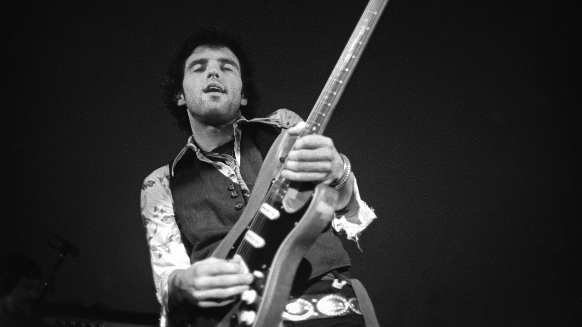Nils Lofgren performs on stage in Amsterdam, Netherlands, 1975