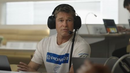 Brad Pitt wears headphones in the trailer for F1.