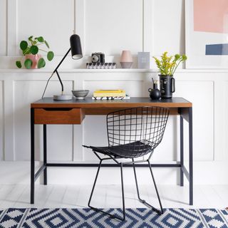 home office with wooden desk and metal chair