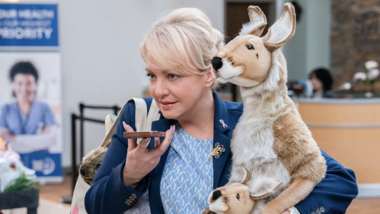 Joynce holding deer figure in in St. Denis Medical Season 2