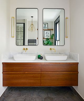 bathroom with double vanity, mirror and drawers