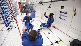 Astronauts using an HTC Vive Focus 3 in zero gravity-like conditions