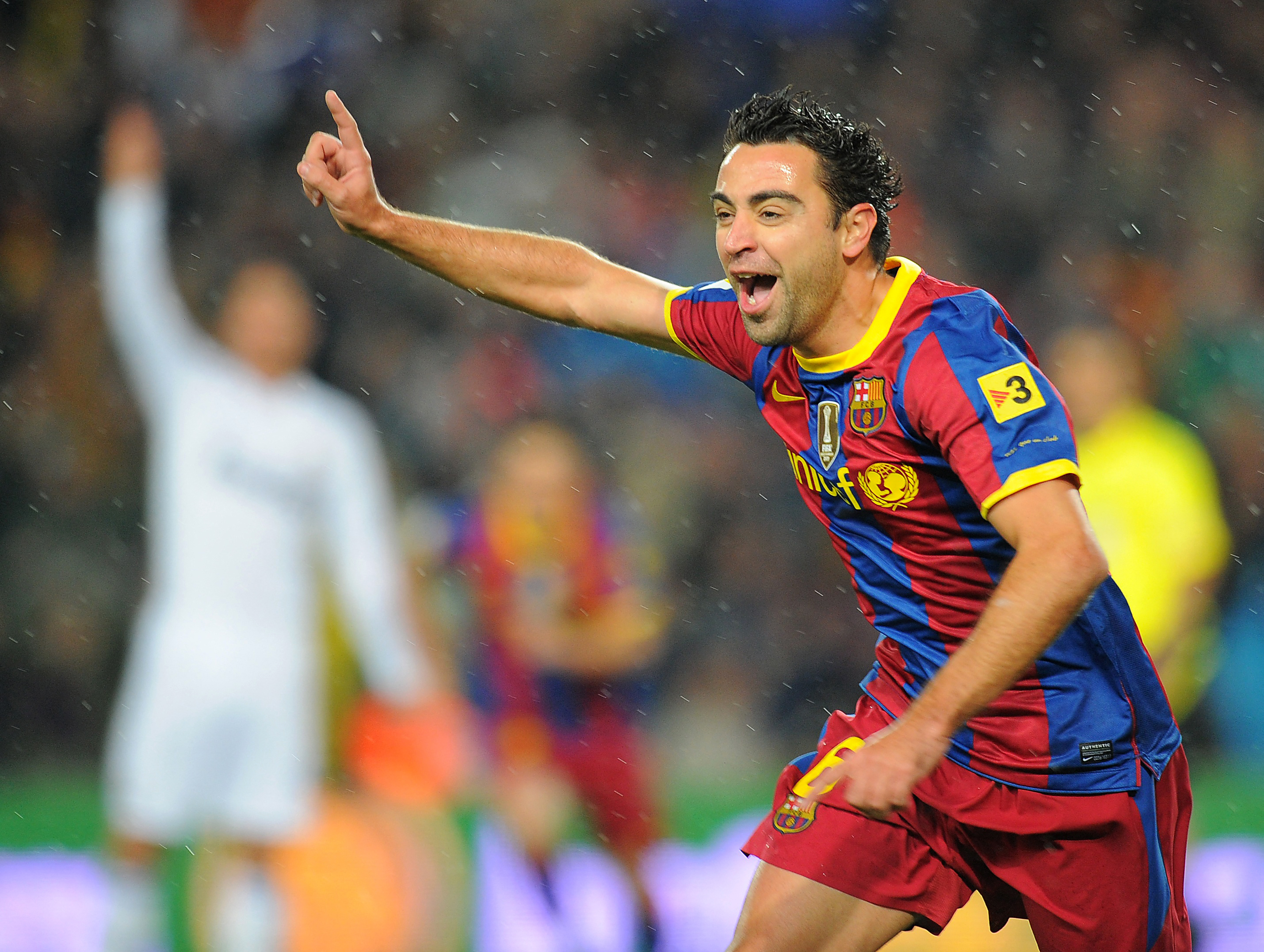 Xavi celebrates after scoring for Barcelona against Real Madrid in November 2010.