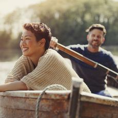 Couple rowing in a boat