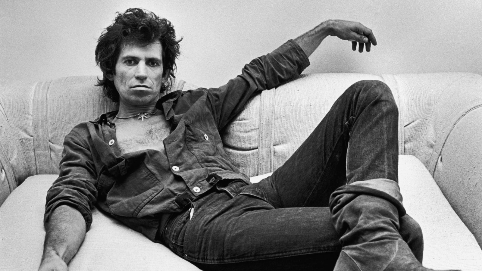 keith richards on a couch in his office in the 80s
