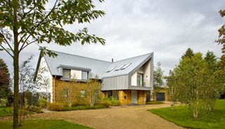 modern timber frame houses with zinc roof