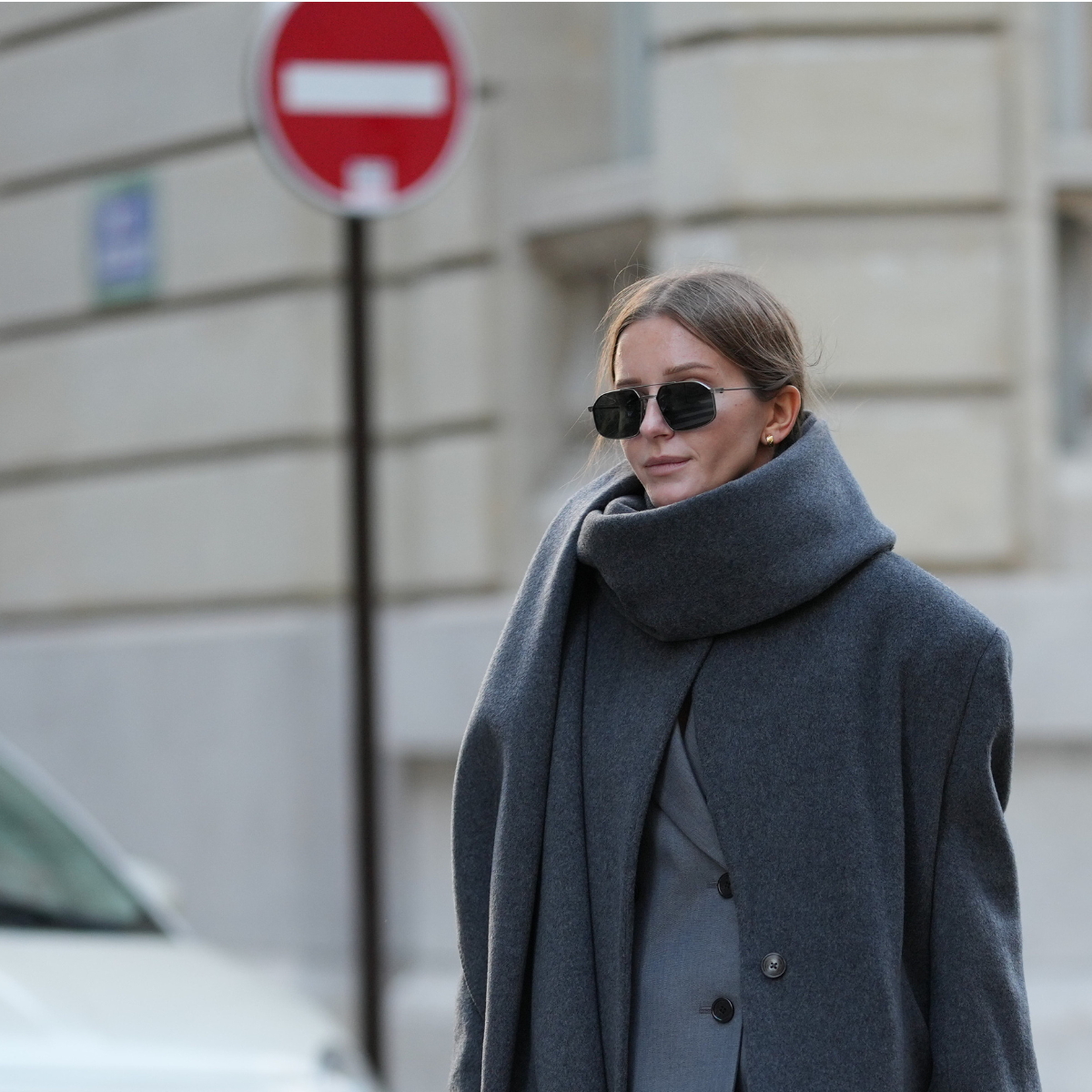 Best gel moisturisers Diane Batoukina wears a long grey wool coat and matching scarf by By Aylin Koenig layered over a tailored light grey wool suit by The Frankie Shop