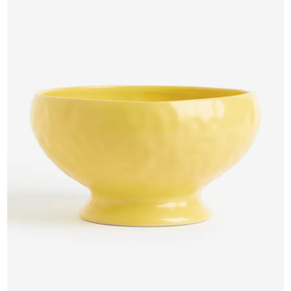 yellow serving bowl with standing design