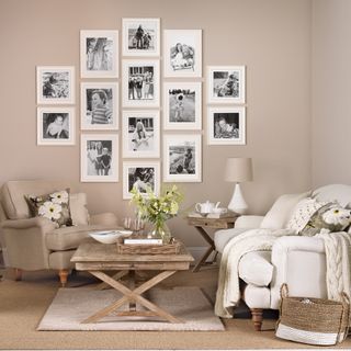living space with carpet flooring and wall photo collage