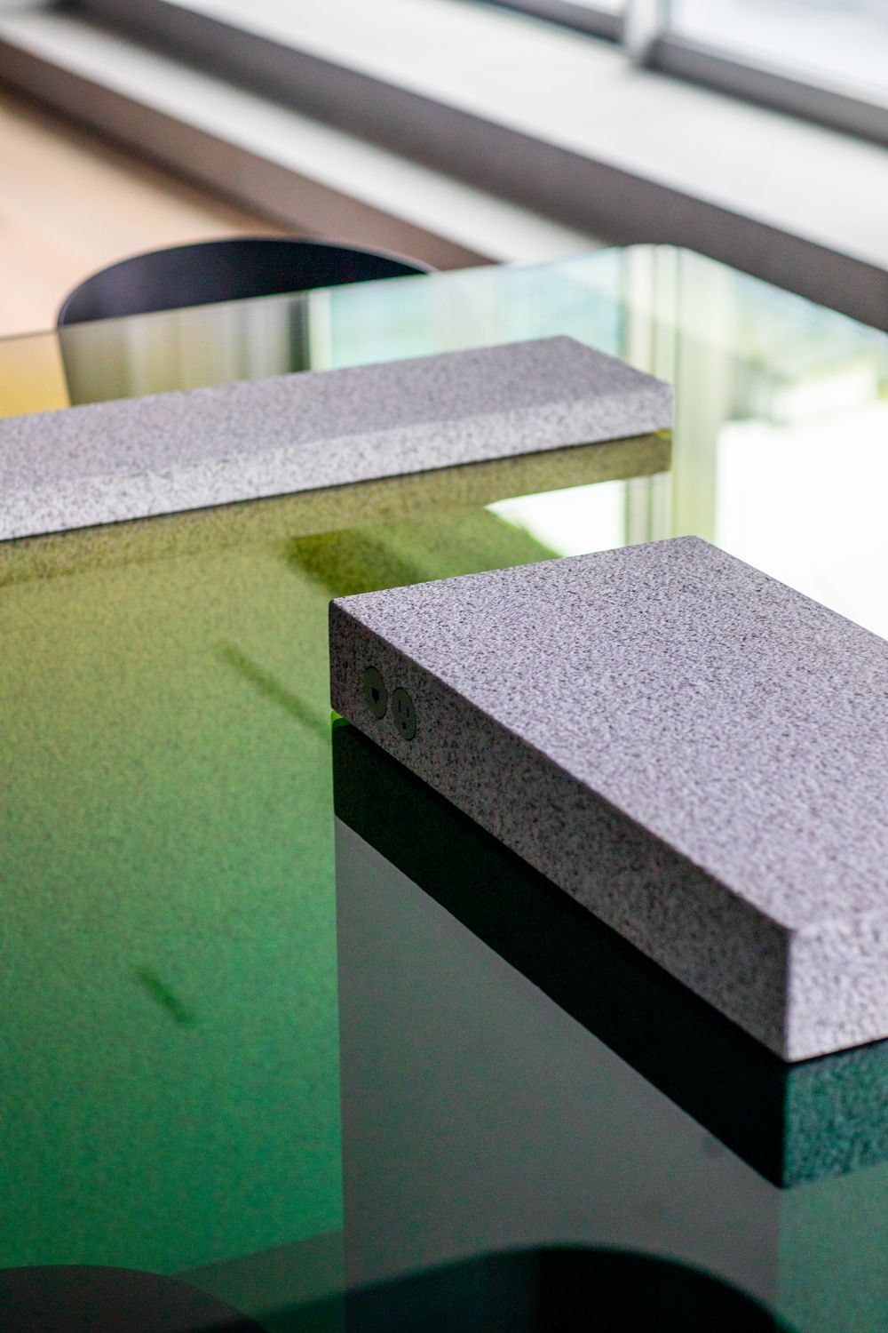 close up of dining table with power outlets in concrete slab